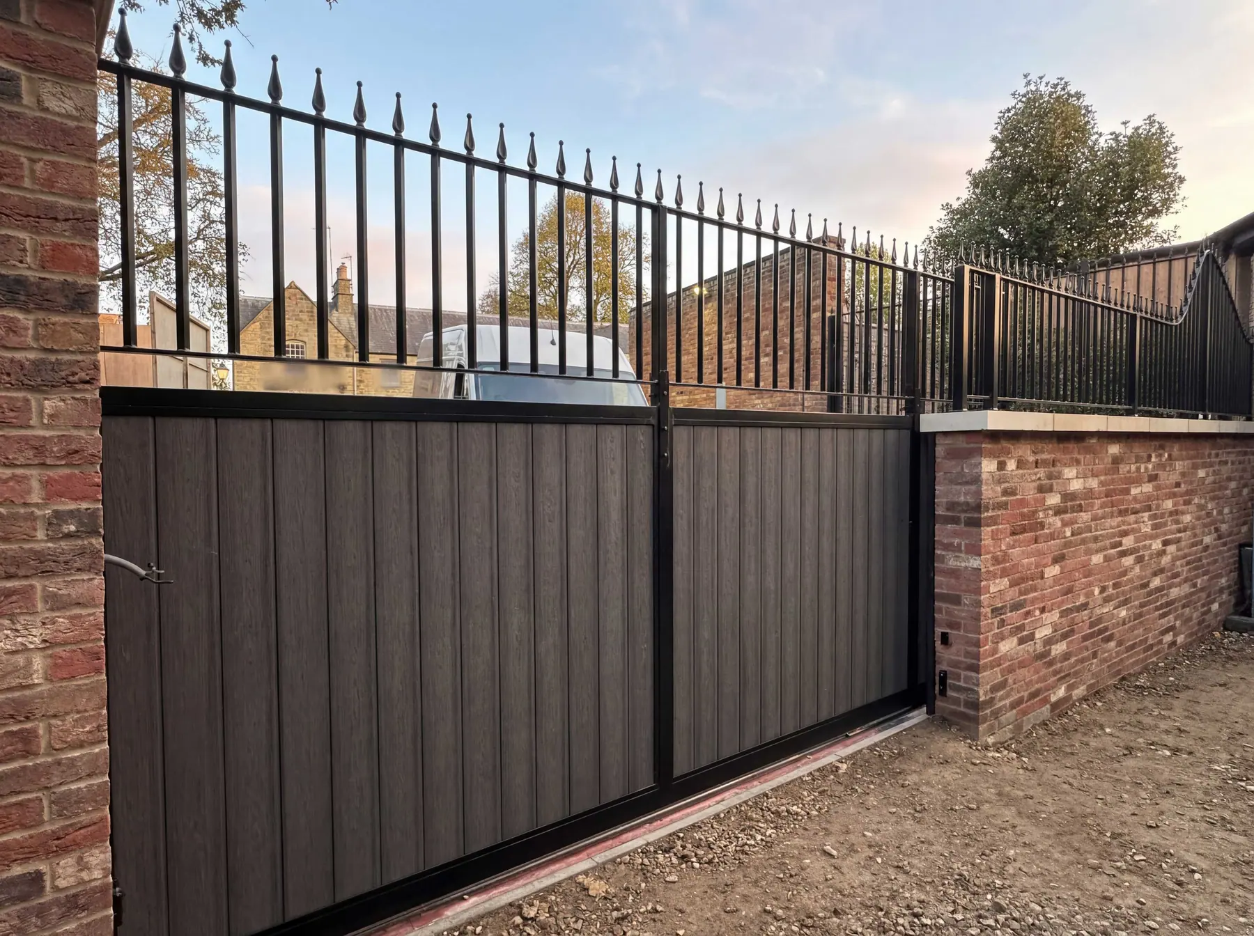 Contemporary slatted aluminium driveway gates, electric motor, privacy design, Bradford